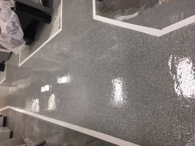 Concrete Inspirations Ltd - White & Bright! Our Signature Crystal White  Metallic Epoxy Flooring really brightens up this basement living space.  This application is suitable for both residential and commercial  environments and